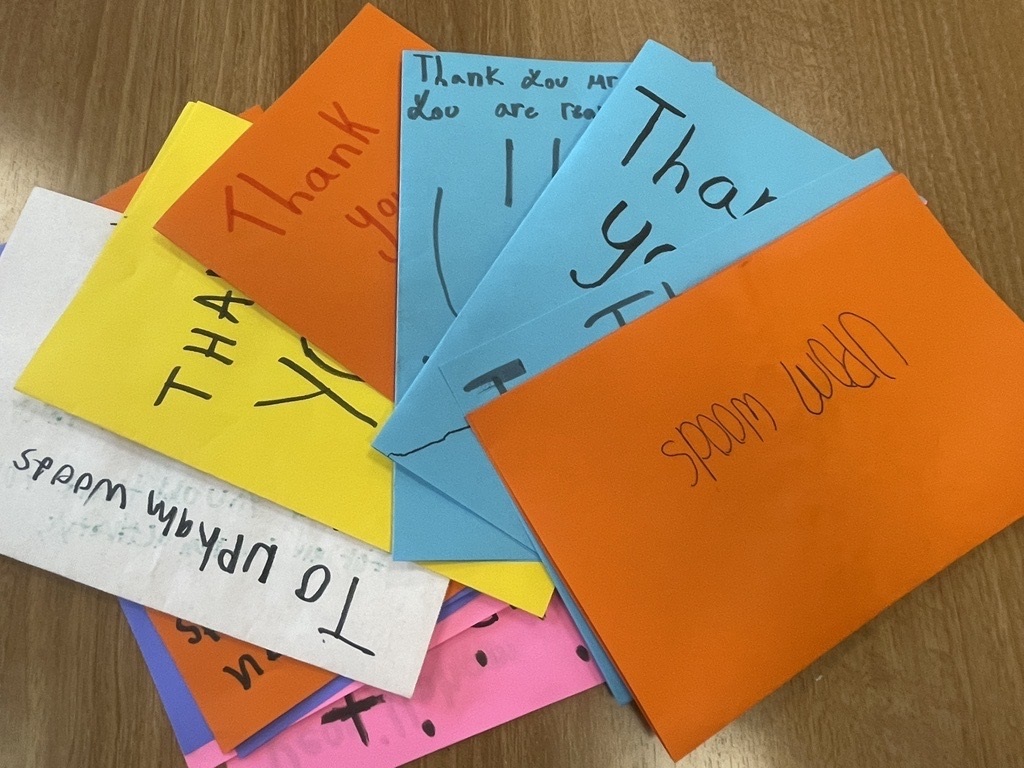 fan of colorful thank you cards with childlike handwriting